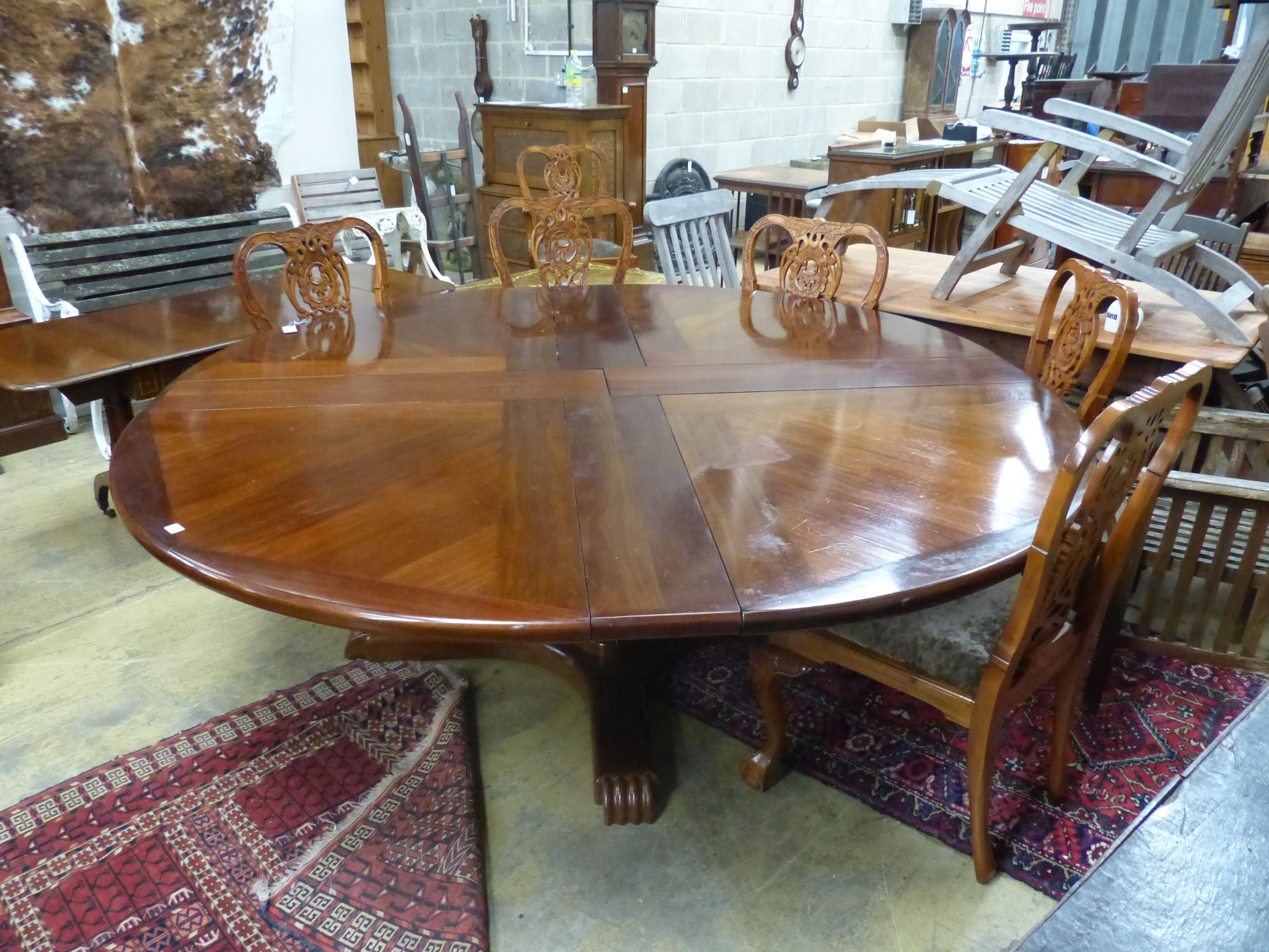 A Jupes patent style mahogany extending circular dining table, 224cm extended, height 74cm